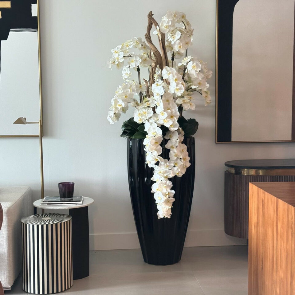 San Jose Vase in glossy black with hanging yellow orchids